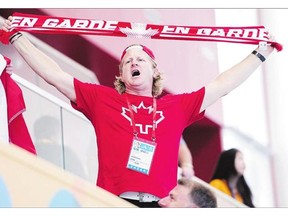 Curt Harnett, Canada's chef de mission, cheers during a women's water polo match between Canada and Brazil at Pan Am Toronto 2015 in Markham, Ont., in early Pan Am action.
