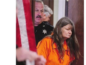 Deborah Leonard enters the courtroom on Friday in New Hartford, N.Y. Leonard and her husband have been charged with fatally beating their 19-year-old son, Lucas, in a church.