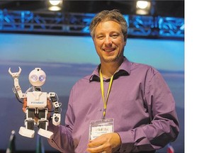 Dennis Kambeitz with an EZ-Robot after his talk at STEM fest at Prairieland Park on Tuesday.