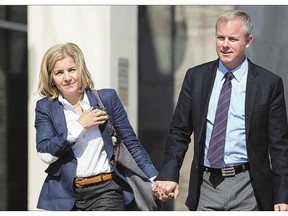 Dennis Oland and his wife Lisa leave the courthouse in Saint John, N.B., on Wednesday. Oland is charged with seconddegree murder in the death of his father, Richard Oland, who was found dead in his Saint John office on July 7, 2011.