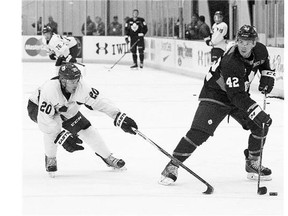 Devin Setoguchi, left, giving chase to Tyler Bozak at the Toronto Maple Leafs training camp, is getting a look at a professional tryout after playing with the Flames last season.