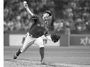 R.A. Dickey of the Toronto Blue Jays throws against the Boston Red Sox in the fourth inning at Fenway Park on Tuesday in Boston, Massachusetts.