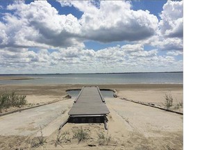 A dock at Douglas Provincial Park on Lake Diefenbaker is high and dry in late June due to low water levels.