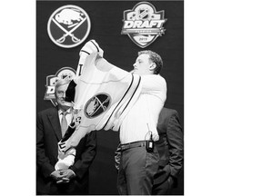 No. 2 draft pick Jack Eichel puts on a Buffalo Sabres jersey at the NHL Draft on June 26. A lot of hype has been building around the Massachusetts native, who hit the ice in Buffalo on Monday for the team's development camp.