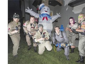 Dressed in the part of Ghostbusters for the upcoming Comic Con, are, from left, Chris Fischer, Blake Chodoriwsky, Evan Burr, Travis Hoffman, Julie Chodoriwsky and Natasha Kramble. When Blake Chodoriwsky started the group, his wife Julie thought 'they'd just look like dorks dressed up like Ghostbusters and nobody would care.' But the reaction was 'incredible.'