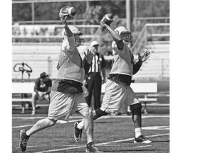 Edmonton Eskimos quarterbacks Matt Nichols, left, and James Franklin appear to be executing a synchronized passing drill during a recent practice.