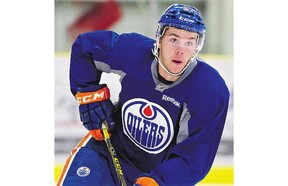 Edmonton Oilers' Connor McDavid skates during training camp in Leduc, Alta., on Sunday . McDavid will play in Saturday's Oilers-Wild exhibition game in Saskatoon.