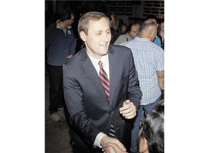 Re-elected Saskatoon-University Conservative MP Brad Trost shakes hands with supporters on Monday,