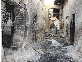 An employee of Doctors Without Borders stands inside the charred remains of their hospital on Friday after it was hit by a U.S. airstrike in Kunduz, Afghanistan on Oct. 3.