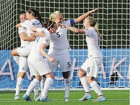 England's Lucy Bronze, from left, Fara Williams, Jade Moore, Steph Houghton and Laura Bassett celebrate after defeating Norway in FIFA Women's World Cup round of 16 soccer action in Ottawa on Monday.