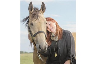 Erin Wasson, a grief counsellor with the Western College of Veterinary Medicine at the University of Saskatchewan, shown with her horse Gunner at her farm on Tuesday, is helping to launch a veterinary social work program at the U of S.