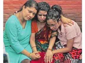 Family members of Laxman Neupane, one of the police officers killed in Monday's clashes in western Nepal, mourn after his body was brought to Kathmandu on Tuesday.