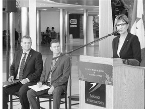 Federal Minister of State Lynn Yelich announces funding for the Regina and Saskatoon airport authorities at the John Diefenbaker International Airport on Thursday. Looking on are Dick Graham, left, president and CEO of the Regina Airport Authority, and Stephen Maybury, president and CEO of the Saskatoon Airport Authority.