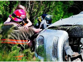 Two females were pulled with the help of Saskatoon firefighters from this minivan that rolled on Carmart Road southwest of Saskatoon on Tuesday. Neither were seriously injured and were able to walk to the ambulance to be checked out.