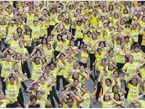 Filipinos dance to high-tempo music for 30 consecutive minutes during a Zumba class in suburban Mandaluyong, east of Manila, Philippines on Sunday. The Philippines city now holds the Guinness world record for the largest Zumba class in a single venue, with a total of 12,975 participants.