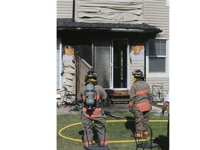 Firefighters at a condo blaze at 410 Ledingham Way, on Friday, July 24, 2015.