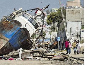 A fishing boat moored in the port of Coquimbo, Chile, some 445 kilometres north of Santiago, was washed ashore by waves following an earthquake late Wednesday.