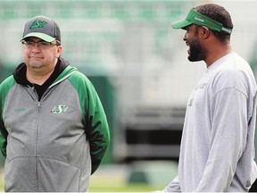 Former general manager Brendan Taman, left, and former head coach Corey Chamblin were fired by the Roughriders on Monday, but Taman is still rooting for the team to win.