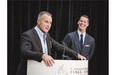 Former NHL star Paul Coffey, left, with presenter Mark Tewksbury, addresses the media in Toronto after being formally inducted into the Canadian Sports Hall of Fame on Wednesday.