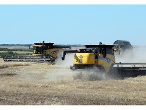 Franck Groeneweg and his crew from Green Atlantic Farms located at Edgeley, Sask. make short work straight combining a Canola field northeast of Edgeley near Fort Qu’Appelle September 16, 2014.