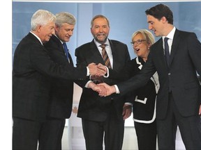 From left: Bloc Quebecois Leader Gilles Duceppe, Conservative Leader Stephen Harper, New Democratic Party Leader Tom Mulcair, Green Party Leader Elizabeth May and Liberal Leader Justin Trudeau shake hands before the start of the French-language leaders' debate in Montreal on Sept. 24. Voters go to the polls Monday.