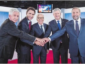 From left, Bloc Quebecois Leader Gilles Duceppe, Liberal Leader Justin Trudeau, journalist Pierre Bruneau, Conservative Leader Stephen Harper and NDP Leader Tom Mulcair are shown prior to Friday's French-language debate in Montreal.