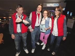 From left: Ethan Bent, Clint Hiebert, Kelly Hiebert and Rebecca Ward came dressed as Back to the Future characters Marty McFly and Jennifer Parker for a showing of the movie at Scotiabank Theatre on Wednesday.