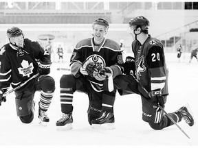 From left: Toronto Maple Leafs' Connor Brown, Edmonton Oilers' Connor McDavid, and Arizona Coyotes' Dylan Strome take a break during the NHLPA Rookie Showcase in Toronto Tuesday.