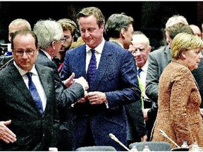 Front, from left: French President Francois Hollande, European Commission president Jean-Claude Juncker, British Prime Minister David Cameron and German Chancellor Angela Merkel arrive for an emergency EU heads of state summit on the refugee crisis in Brussels on Wednesday.