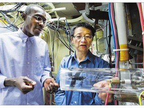 Fusion researchers, including Richard Kamendje, left, from the United Nations' International Atomic Energy Agency, are working with U of S researcher Chijin Xido at the University of Saskatchewan lab.