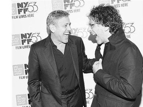 George Clooney, left, and Joel Coen share a joke at the 15th-anniversary screening of O Brother, Where Art Thou?