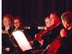 Gino Quillico and the Saskatoon Symphony Orchestra perform at the Red and Black Affair at the Delta Bessborough Hotel in Saskatoon, October 4, 2014.