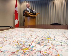 Insp. Donovan Fisher, Officer in Charge of Integrated Organized Crime North, addresses reporters in the boardroom of the Saskatoon RCMP detachment on Thursday.