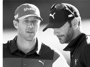 Graham DeLaet of Weyburn talks to his caddy after withdrawing due to an injury during round two of the RBC Canadian Open on Friday at Glen Abbey Golf Club in Oakville.