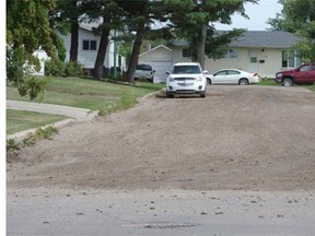 A gravel road on 19th Street West between Vancouver and Winnipeg Avenues, Wednesday, July 22, 2015.