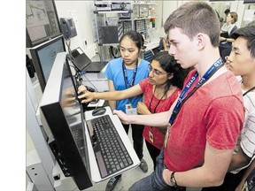 A group of high school students from across Canada are studying snake eyes, specifically the optical scales in the eyes of garter snakes at the synchrotron using a microscope hooked to the beam line.