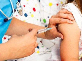 A girl receives an injection in her right arm. A new report shows a significant drop in chickenpox cases in Ontario since a public vaccination campaign against the disease began in 2004.