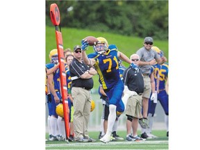 Hilltops centre Evan Turkington makes a one-handed catch as the Saskatoon Hilltops take on the Winnipeg Riffles on Sunday.