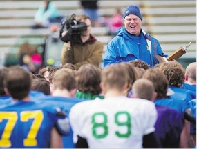 Hilltops Head Coach Tom Sargeant has a laugh with his players during the spring camp at SMS field earlier this year. The junior team launches the defence of its Canadian Bowl title when the regular season gets underway Sunday in Calgary.