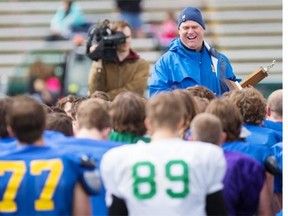 Hilltops Head Coach Tom Sargeant has a laugh with his players prior to award the camp MVP during the Saskatoon Hilltops spring camp at SMS field on Sunday, May 3rd, 2015. (LIAM RICHARDS/The StarPhoenix)