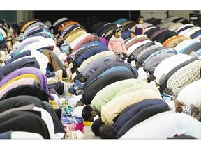 Hundreds of Muslims gather at Prairieland Park on Thursday to join the Eid al-Adha prayer conducted by the Prairie Muslim Association. The prayer is held during the Festival of Sacri ce. See full story on A3