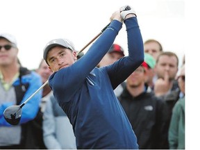 Ireland's Paul Dunne hits a tee shot during third-round action at the British Open Sunday in St. Andrews, Scotland. Dunne, an amateur, shot 6-under 66 to grab a share of the lead with two others heading into Monday's final round.