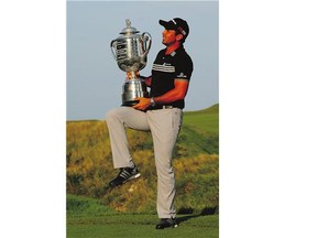 Jason Day holds the Wanamaker Trophy after winning the PGA Championship Sunday at Whistling Straits Golf Club in Kohler, Wis. He shot 67 to finish at 20-under-par for the week.