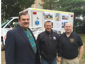 Ukrainian Canadian Congress Saskatoon branch president Michael Gregory, former MD Ambulance Ceo Dave Dutchak and Duck Mountain Ambulance CEO Jim pollock stand in front of the type of donated ambulance that has been sent to transport war wounded in Ukraine.