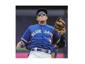 Jays shortstop Troy Tulowitzki reacts as he collides with Blue Jays outfielder Kevin Pillar against the Yankees Saturday.