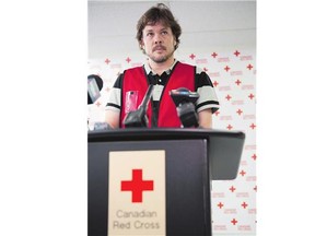 Jean-Pierre Taschereau, senior manager of disaster response for the Red Cross, talks to media about forest fire evacuees in Regina on Monday.