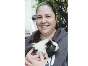 Jennifer Briere with one of her guinea pigs Oreo. Briere created a northern pet registry after the fires broke out.