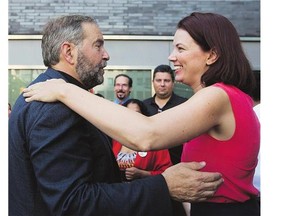 Jennifer Hollett, NDP candidate for Toronto's University-Rosedale riding, is greeted by party leader Tom Mulcair. Hollett is polling ahead of Liberal incumbent Chrystia Freeland.