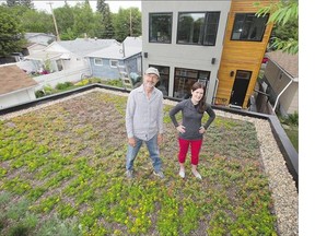 Julie Barnes is the homeowner of Saskatoon's residential largest green roof, a build which incorporates plant life directly in its construction to reduce the home's carbon footprint. Pictured with Barnes is Michael Molaro, who oversaw the installation of the roof.