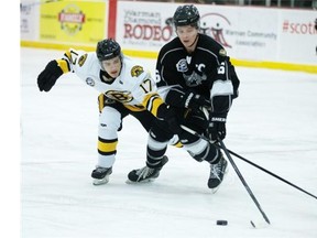 Kaelan Holt of the Estevan Bruins, left, fights Kendall Fransoo of the North Battleford North Stars, in action during SJHL showcase event at the Legends Arena in Warman on Monday. See the column on B2.
